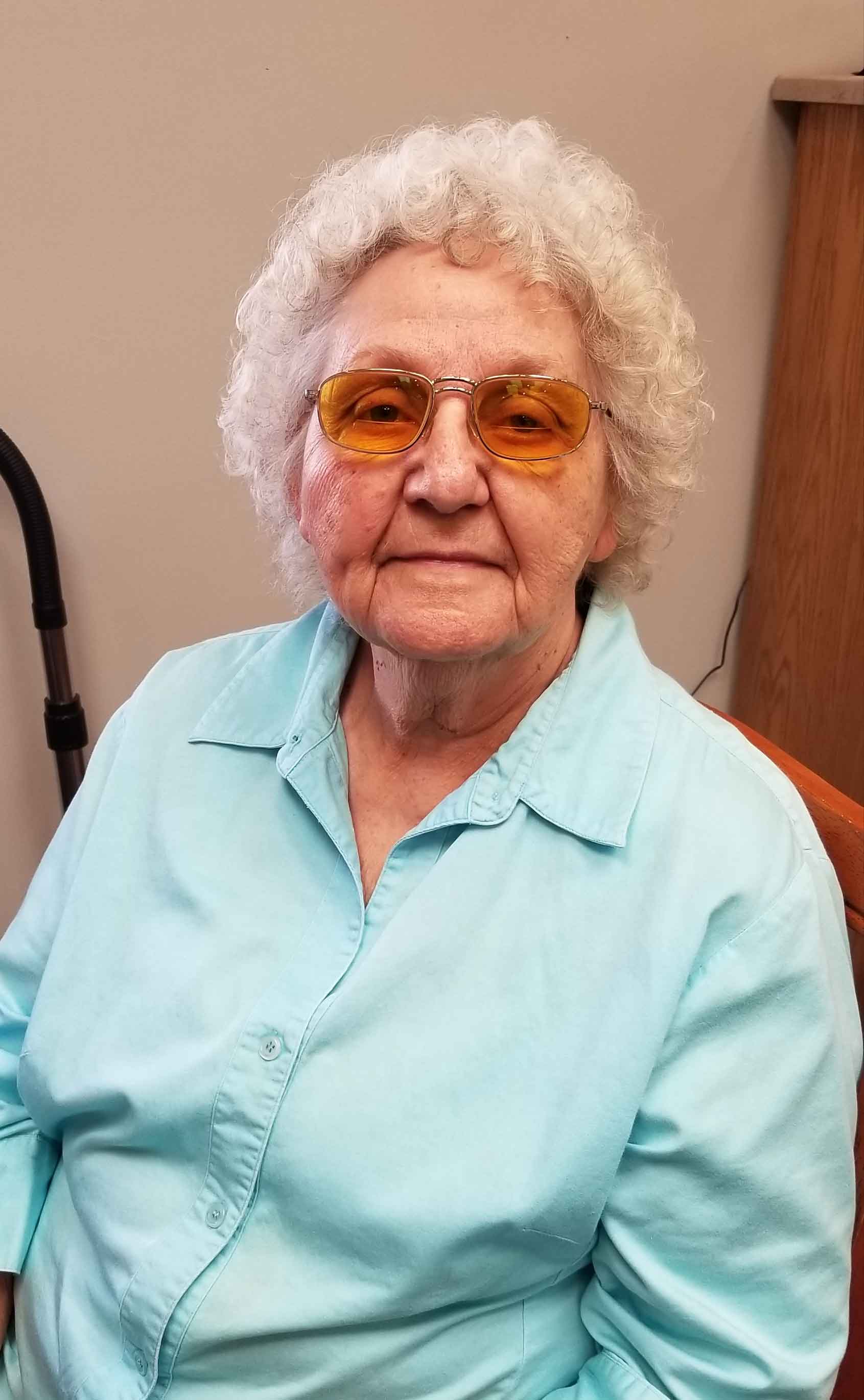 A woman wearing prescription sunglasses from Midwest Low Vision
